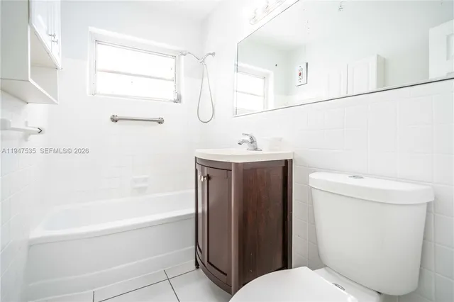 a bathroom with a toilet and a bathtub