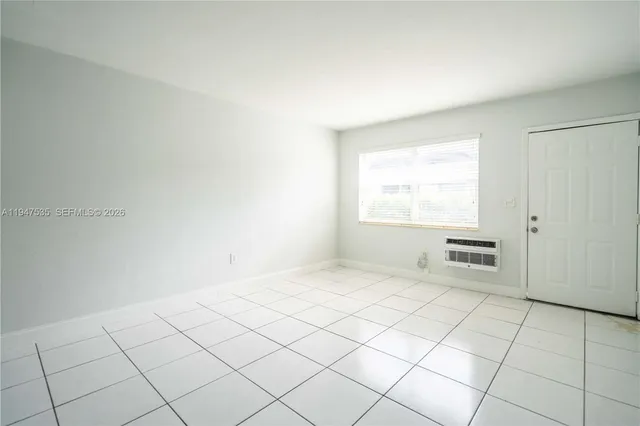 a view of an empty room and window