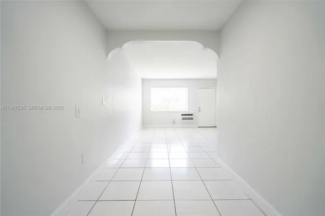 a view of an empty room and window