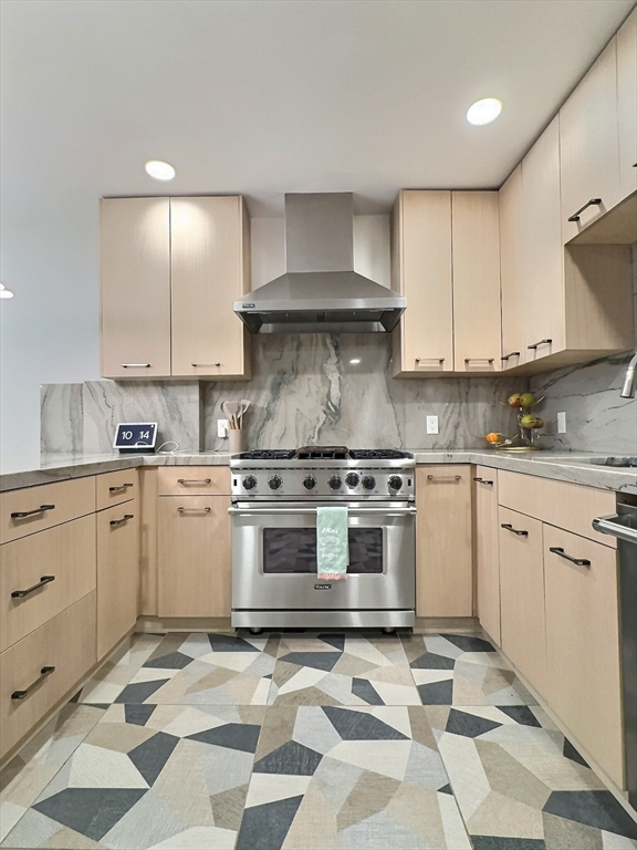 187 London Street, Unit 1 Boston, MA 02128 - Photo 21 of 26 a kitchen with stainless steel appliances granite countertop a stove a sink and a refrigerator