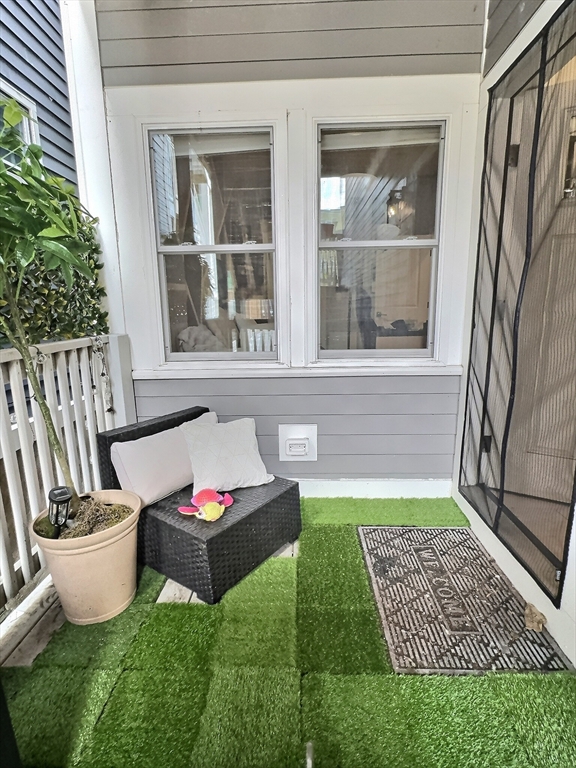 187 London Street, Unit 1 Boston, MA 02128 - Photo 24 of 26 a living room with furniture and a window