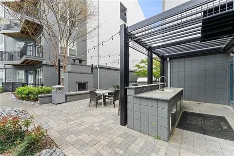 a balcony with furniture and a fireplace