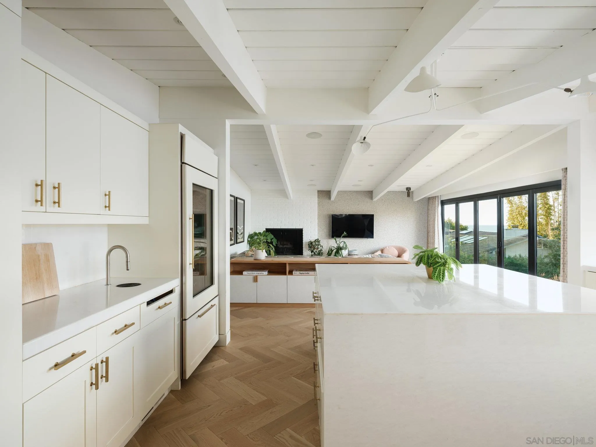 462 15th Street Del Mar, CA 92014 - Photo 12 of 35 a large white kitchen with sink and cabinets