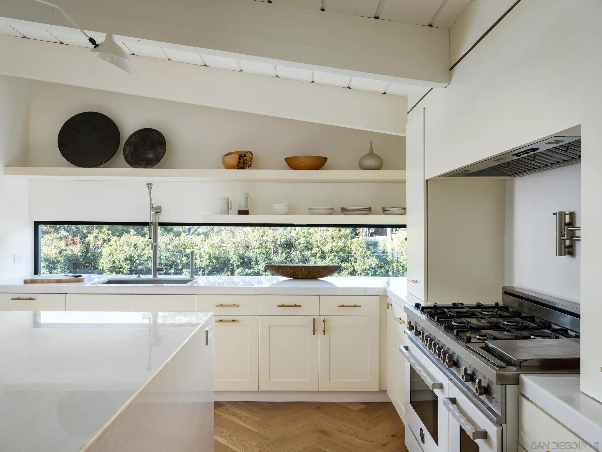 462 15th Street Del Mar, CA 92014 - Photo 13 of 35 a kitchen with a stove and a white refrigerator
