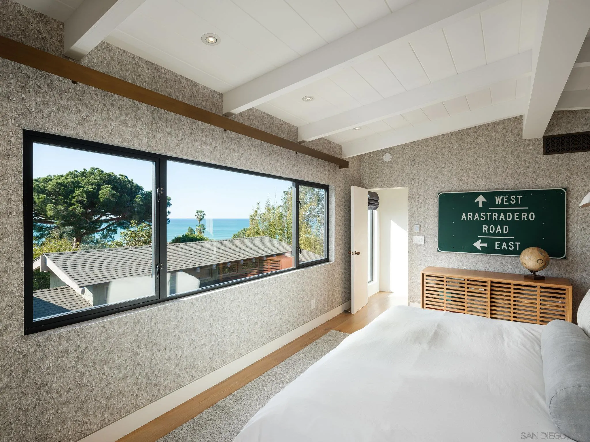 462 15th Street Del Mar, CA 92014 - Photo 20 of 35 a view of an empty room with a fireplace and windows