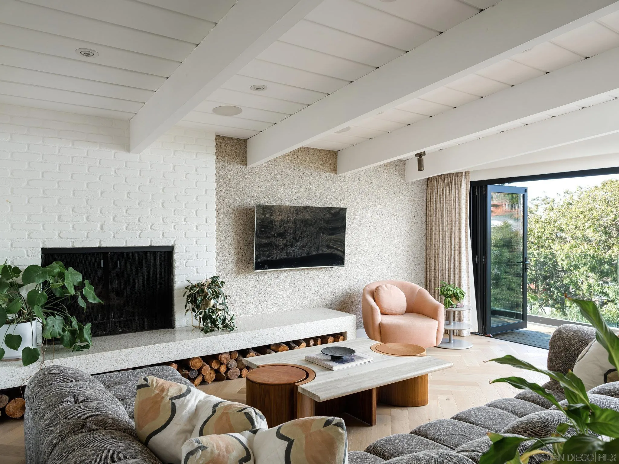 462 15th Street Del Mar, CA 92014 - Photo 2 of 35 a living room with furniture a flat screen tv and a floor to ceiling window