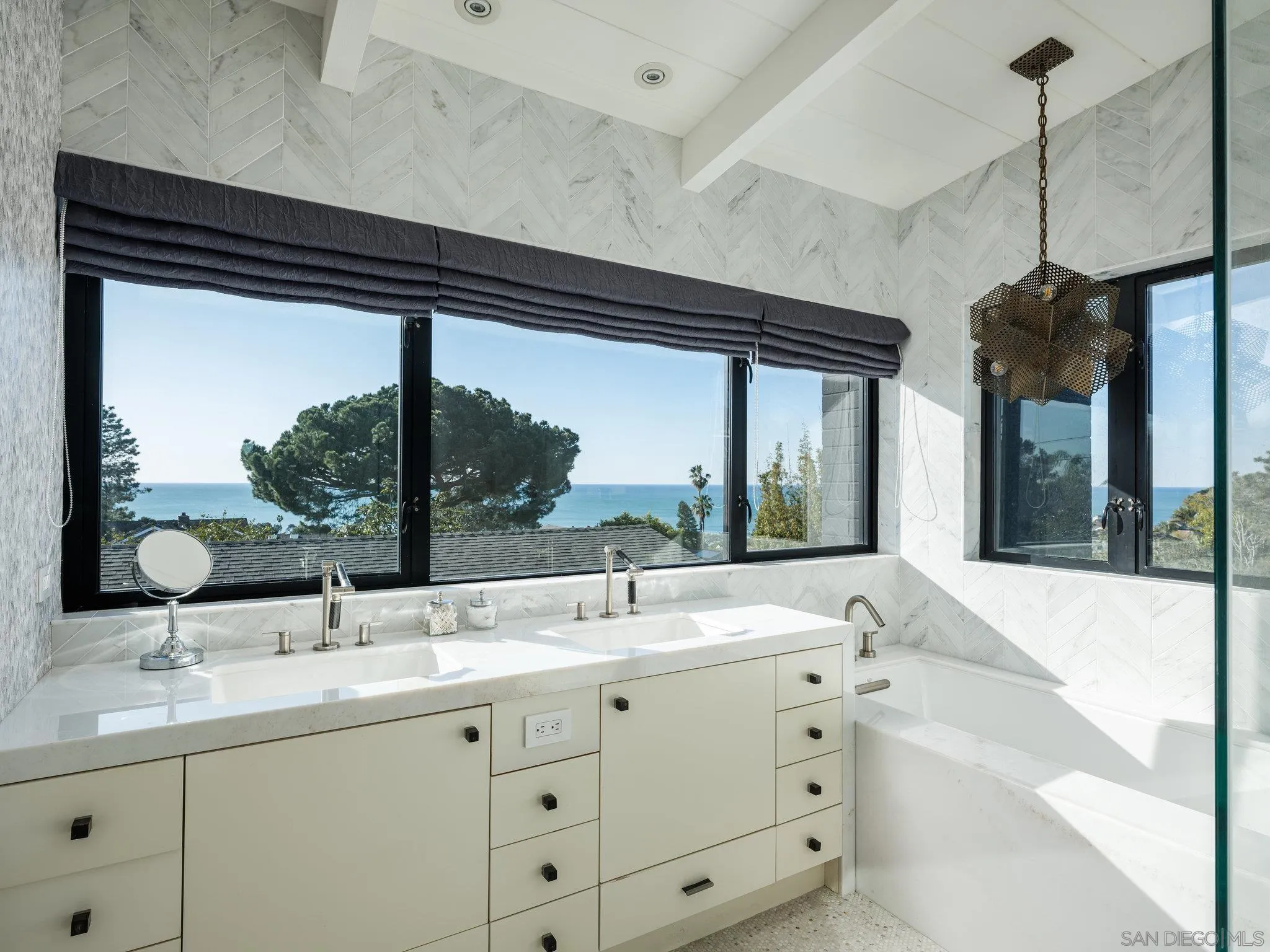 462 15th Street Del Mar, CA 92014 - Photo 22 of 35 a bathroom with a sink and a large mirror
