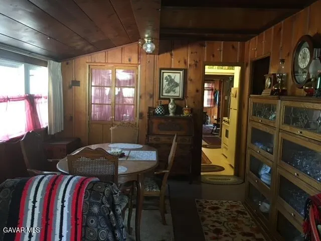 a living room with furniture a lamp and a fireplace