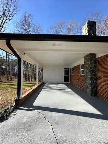 a view of a living room and a floor to ceiling window