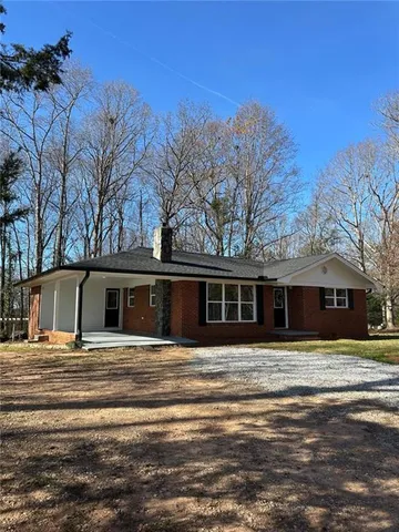 a view of a house with a snow on the ground