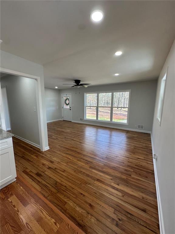 775 Bolton Road Zebulon, GA 30295 - Photo 8 of 17 a view of an empty room with wooden floor and a window