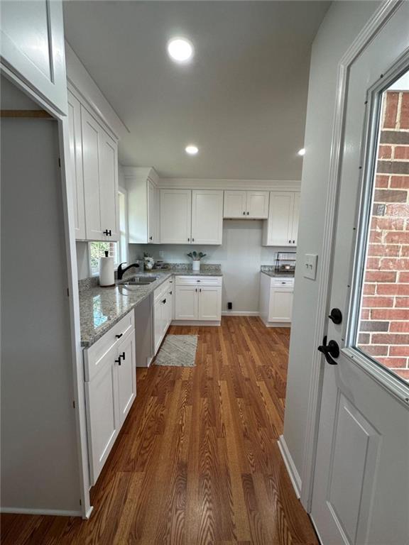 775 Bolton Road Zebulon, GA 30295 - Photo 10 of 17 a kitchen with cabinets a sink and wooden floor