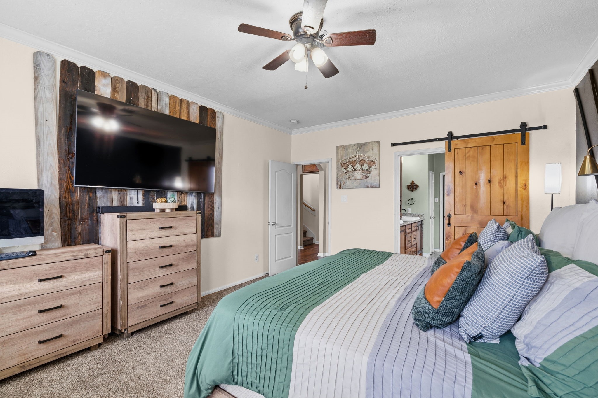 1319 Collier Point Lane Fresno, TX 77545 - Photo 17 of 33 a bedroom with a bed and a flat screen tv