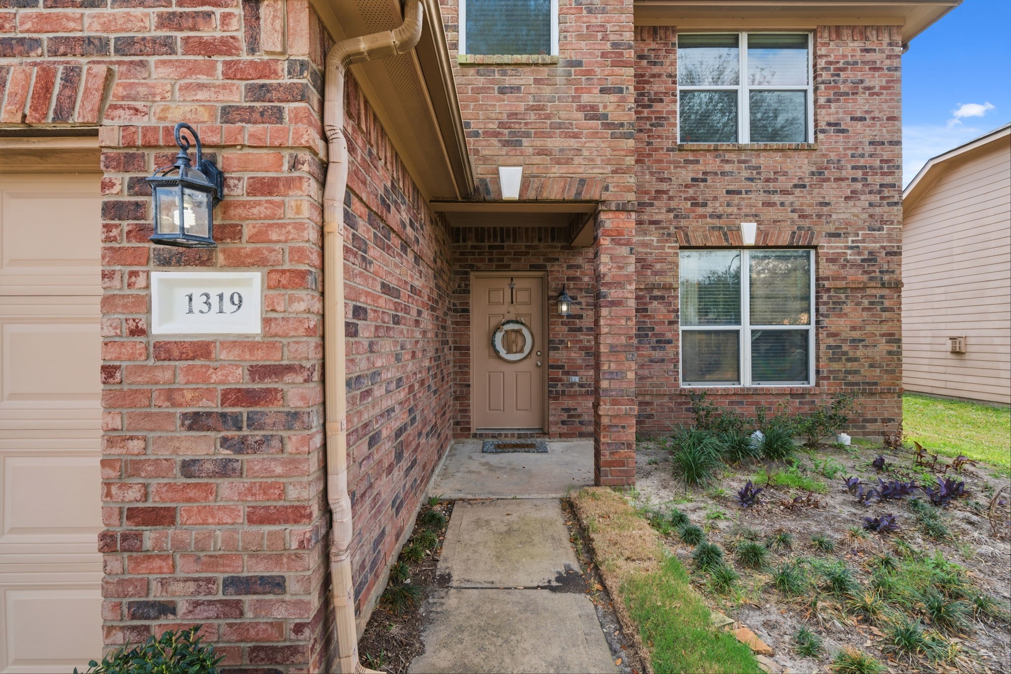 1319 Collier Point Lane Fresno, TX 77545 - Photo 3 of 33 a view of a brick house with many windows