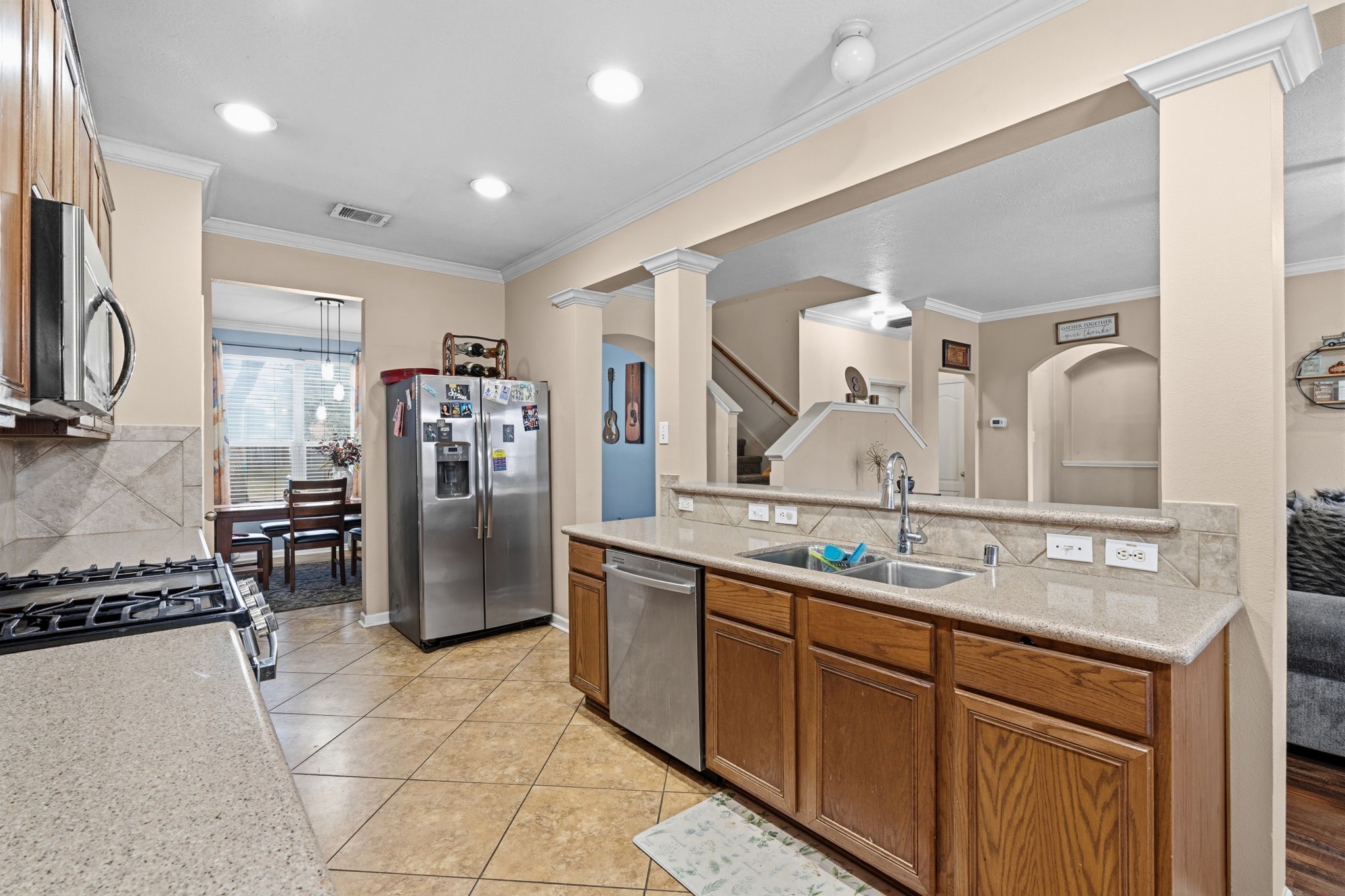 1319 Collier Point Lane Fresno, TX 77545 - Photo 9 of 33 a kitchen with stainless steel appliances granite countertop a refrigerator and a sink