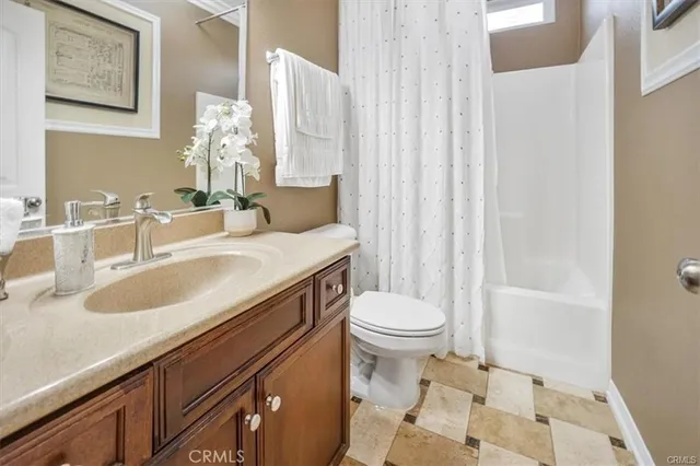 a kitchen with stainless steel appliances granite countertop a stove a sink a microwave and a refrigerator