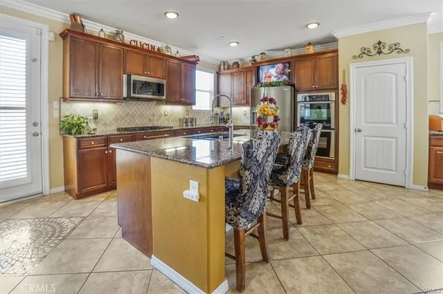 a view of a dining room with furniture and window
