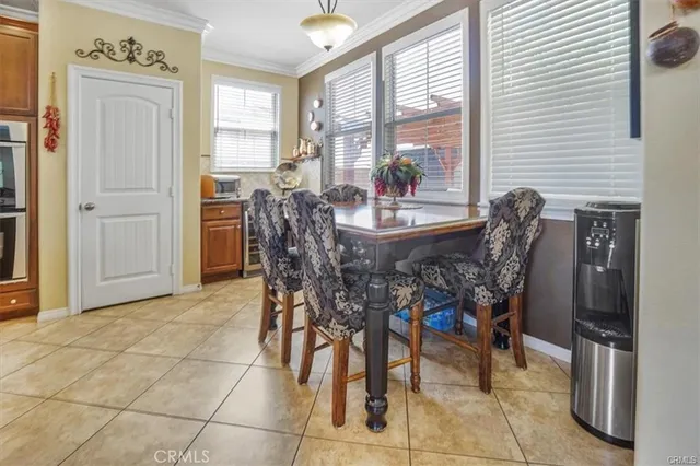 a large kitchen with stainless steel appliances lots of counter space and wooden floor