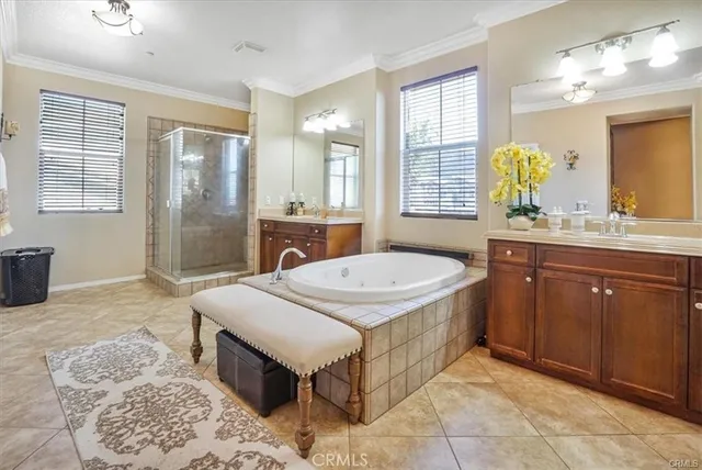 a en suite bathroom with a granite countertop sink and a mirror