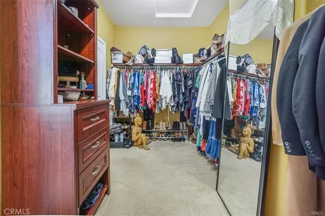 a bedroom with a bed and a ceiling fan