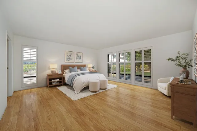 a spacious bathroom with a granite countertop sink mirror and a toilet