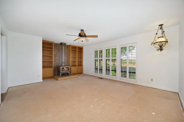a en suite bathroom with a granite countertop sink and a mirror