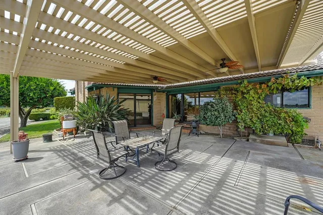 an aerial view of a house with a lake view