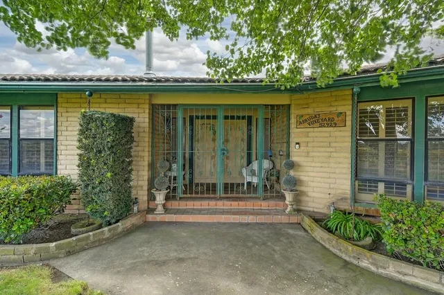 an empty room with fireplace windows and outdoor view