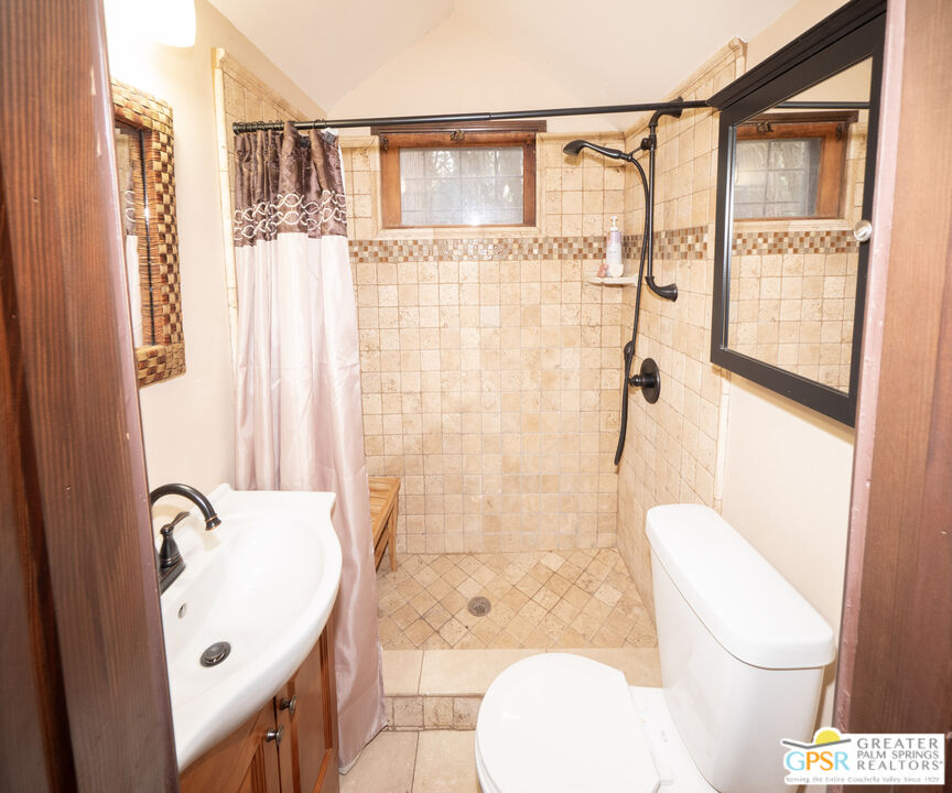 76 7 Oaks Road Angelus Oaks, CA 92305 - Photo 11 of 35 a bathroom with a toilet and shower