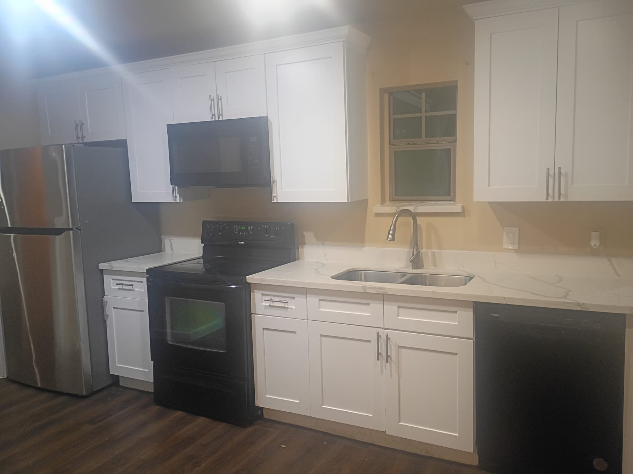 3014 Bloomfield Street Houston, TX 77051 - Photo 5 of 13 a kitchen with a sink cabinets and stainless steel appliances