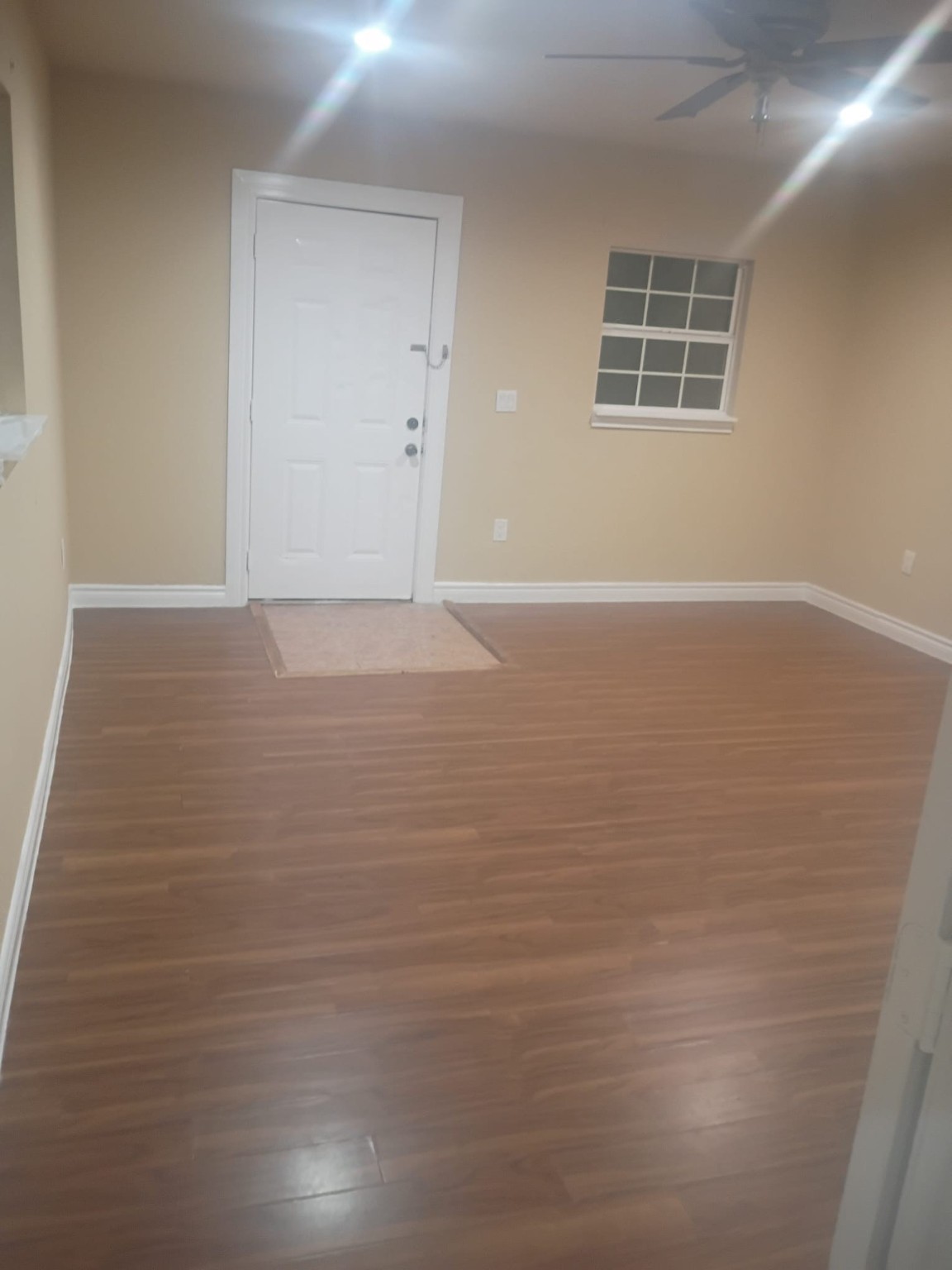 3014 Bloomfield Street Houston, TX 77051 - Photo 7 of 13 a view of an empty room with wooden floor and a window