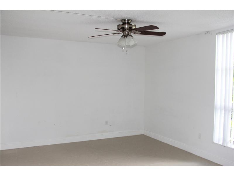 8341 Sands Point Boulevard, Unit 104 Tamarac, FL 33321 - Photo 5 of 8 Master Bedroom
