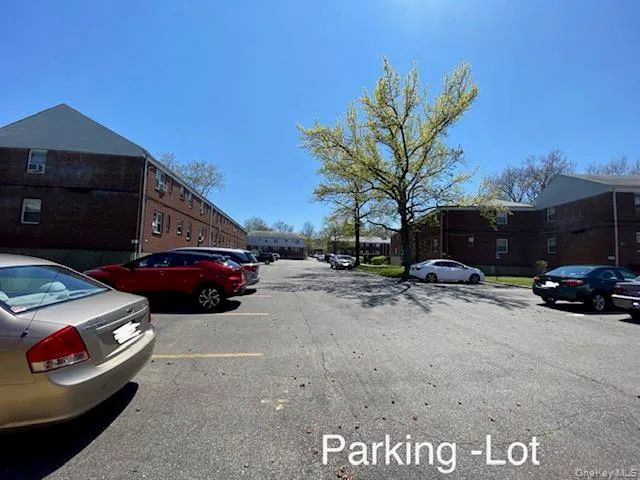 a view of a car parked in front of a house