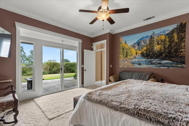 a walk in closet with clothes and shoes