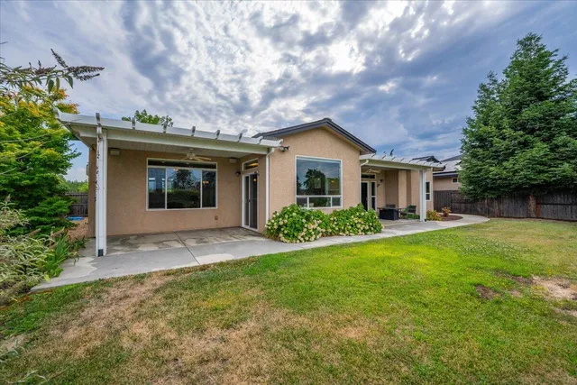 a view of a patio with couches chairs and potted plants