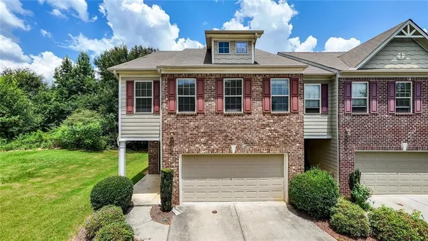 front view of a house with a yard