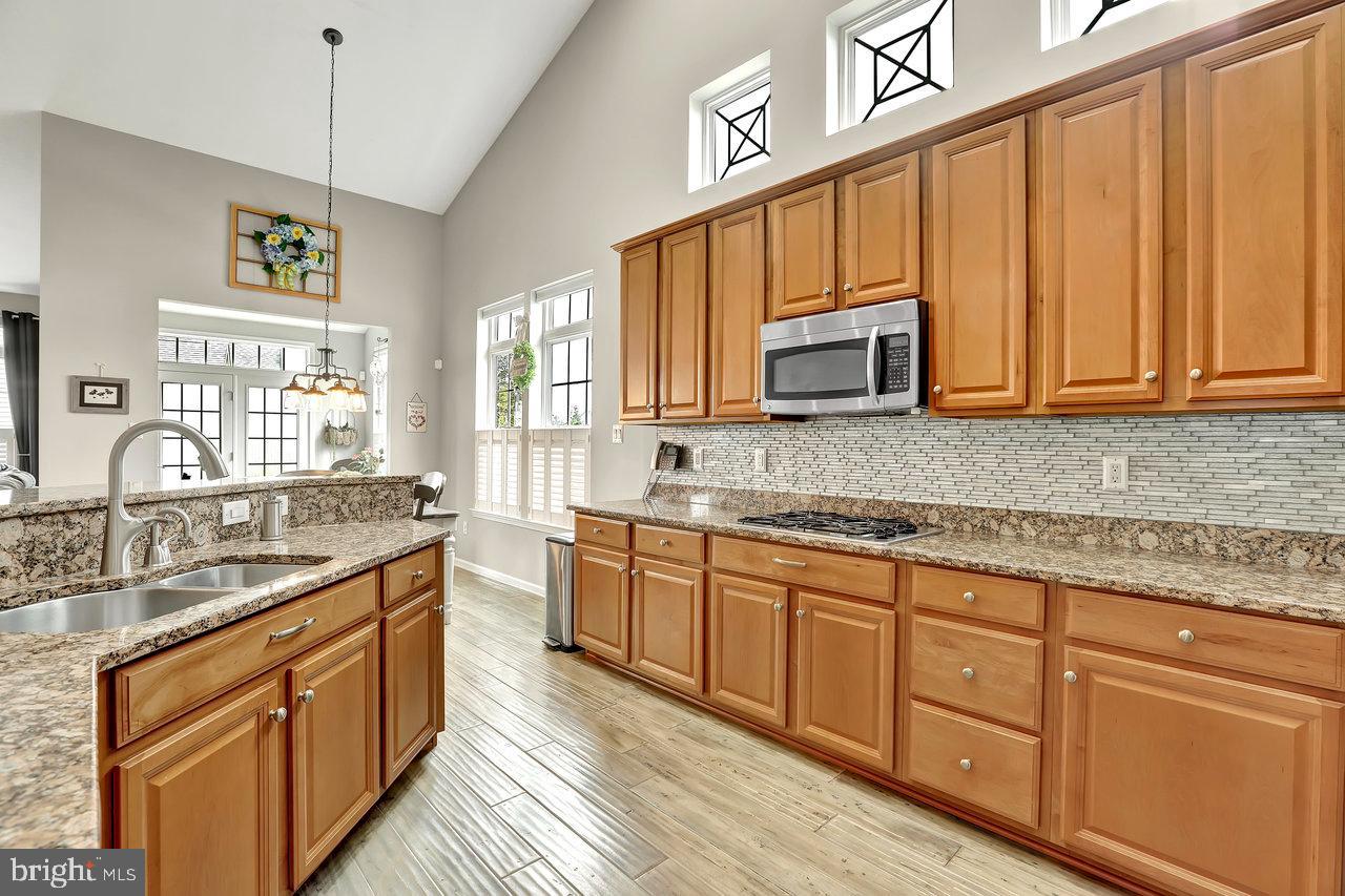 18 Applegate Drive Florence, NJ 08518 - Photo 13 of 81 a kitchen with stainless steel appliances granite countertop a sink stove and cabinets