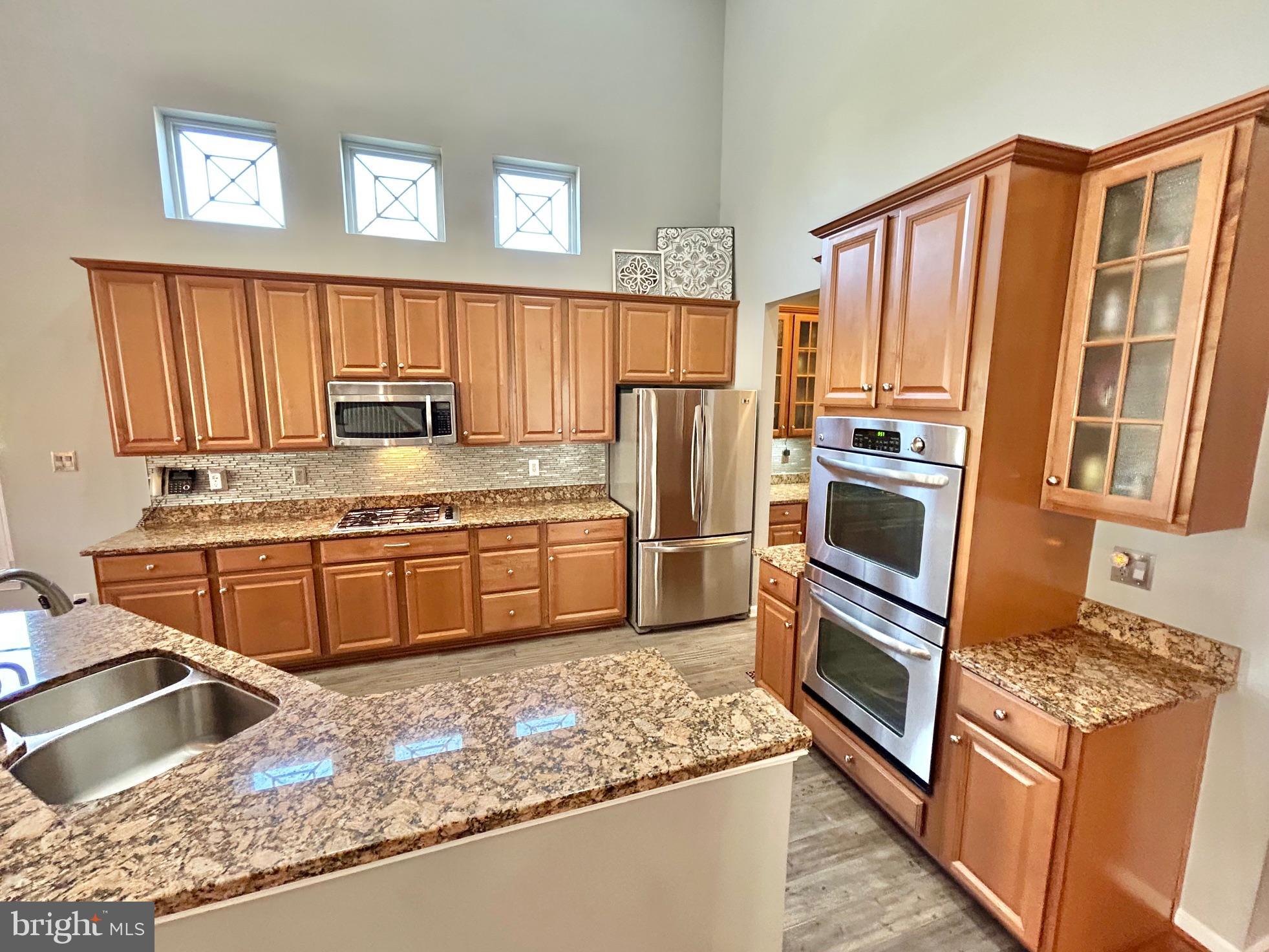 18 Applegate Drive Florence, NJ 08518 - Photo 19 of 81 a kitchen with stainless steel appliances granite countertop a stove a sink dishwasher a refrigerator and a oven