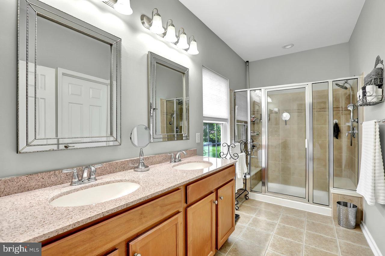 18 Applegate Drive Florence, NJ 08518 - Photo 36 of 81 a spacious bathroom with a double vanity sink mirror and shower