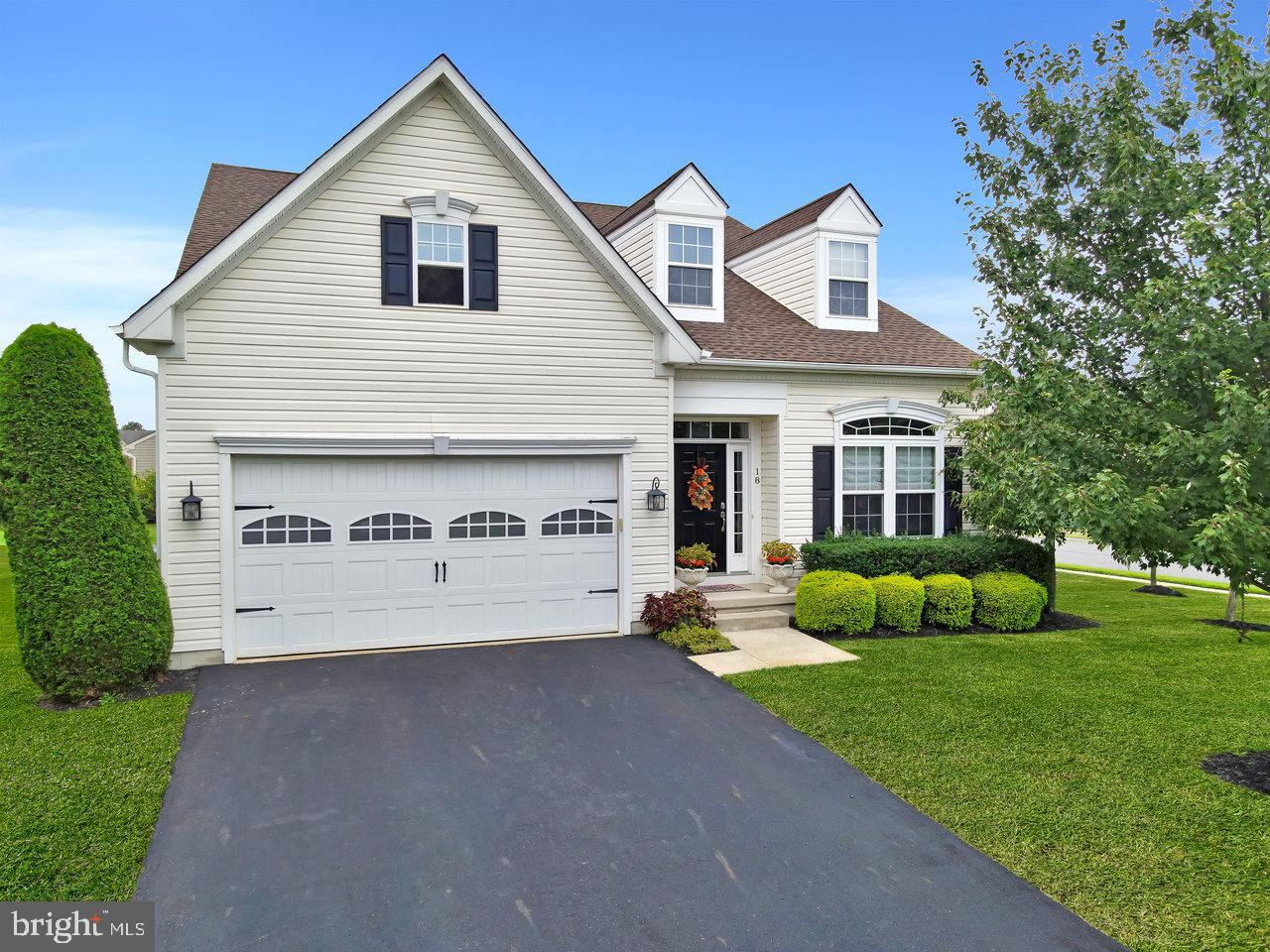 18 Applegate Drive Florence, NJ 08518 - Photo 58 of 81 a view of a white house with a yard and potted plants
