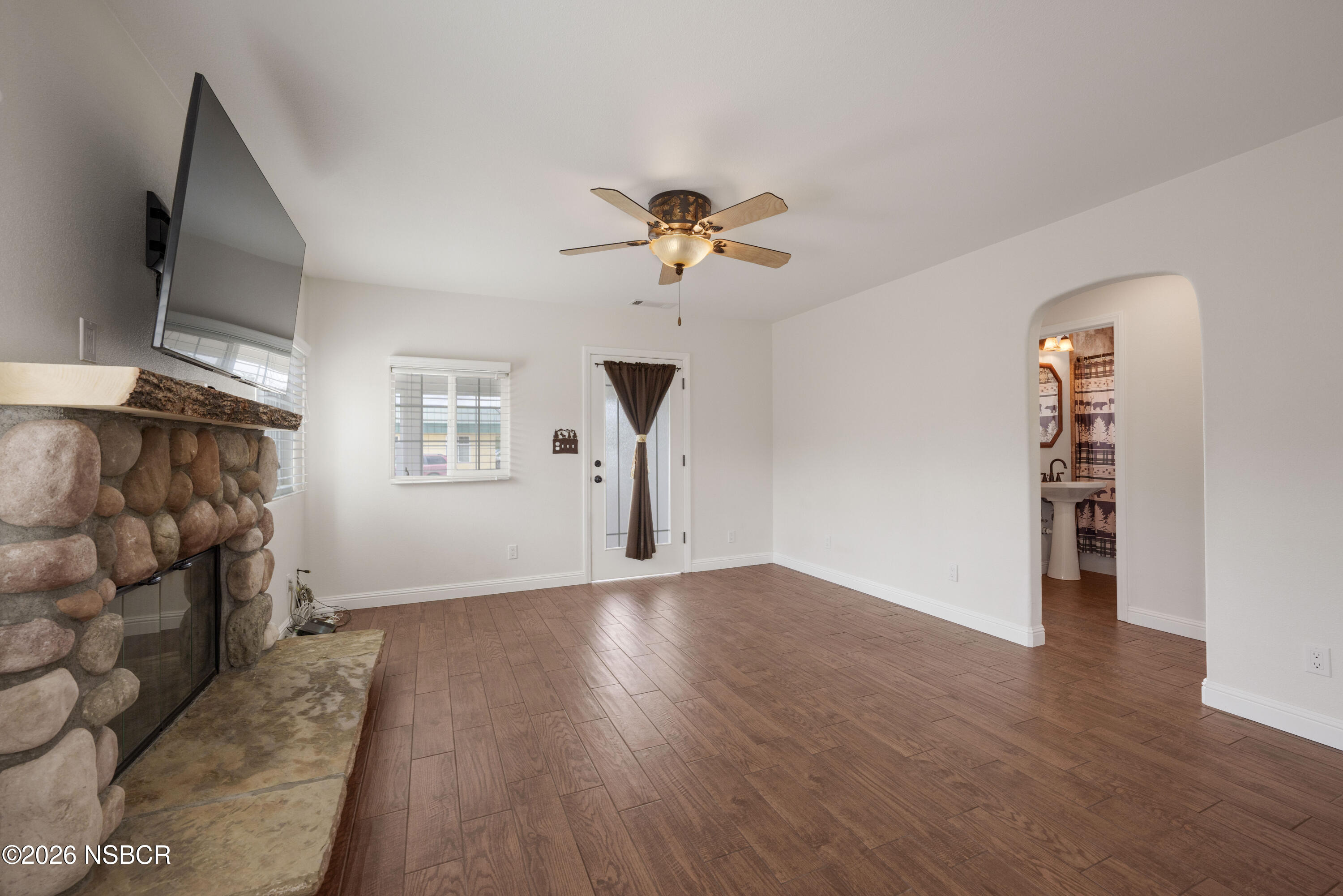 138 North E Street Lompoc, CA 93436 - Photo 8 of 35 wooden floor in an empty room with a window