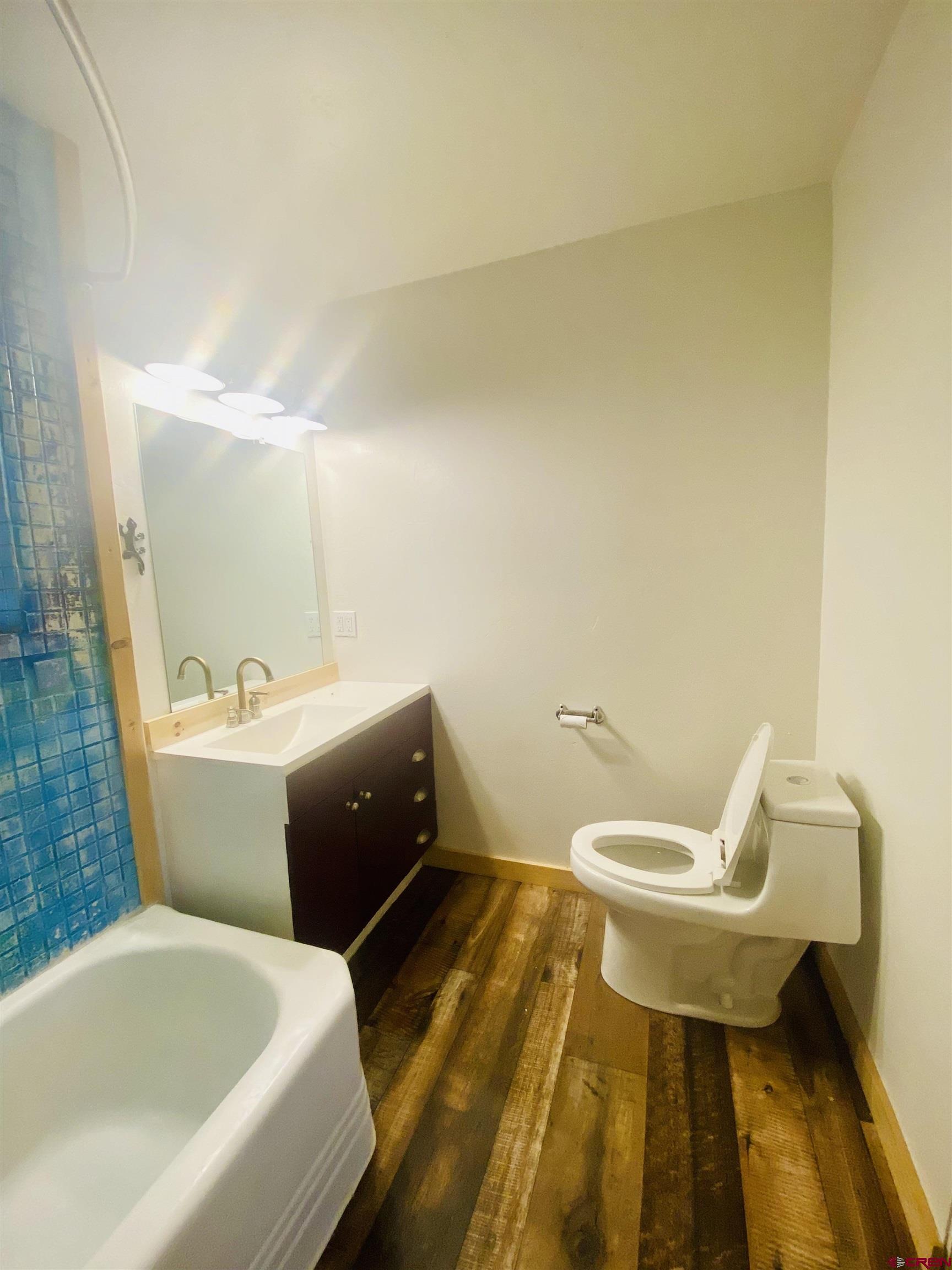 646 Riverside Avenue Mancos, CO 81328 - Photo 16 of 36 a bathroom with a sink and a mirror