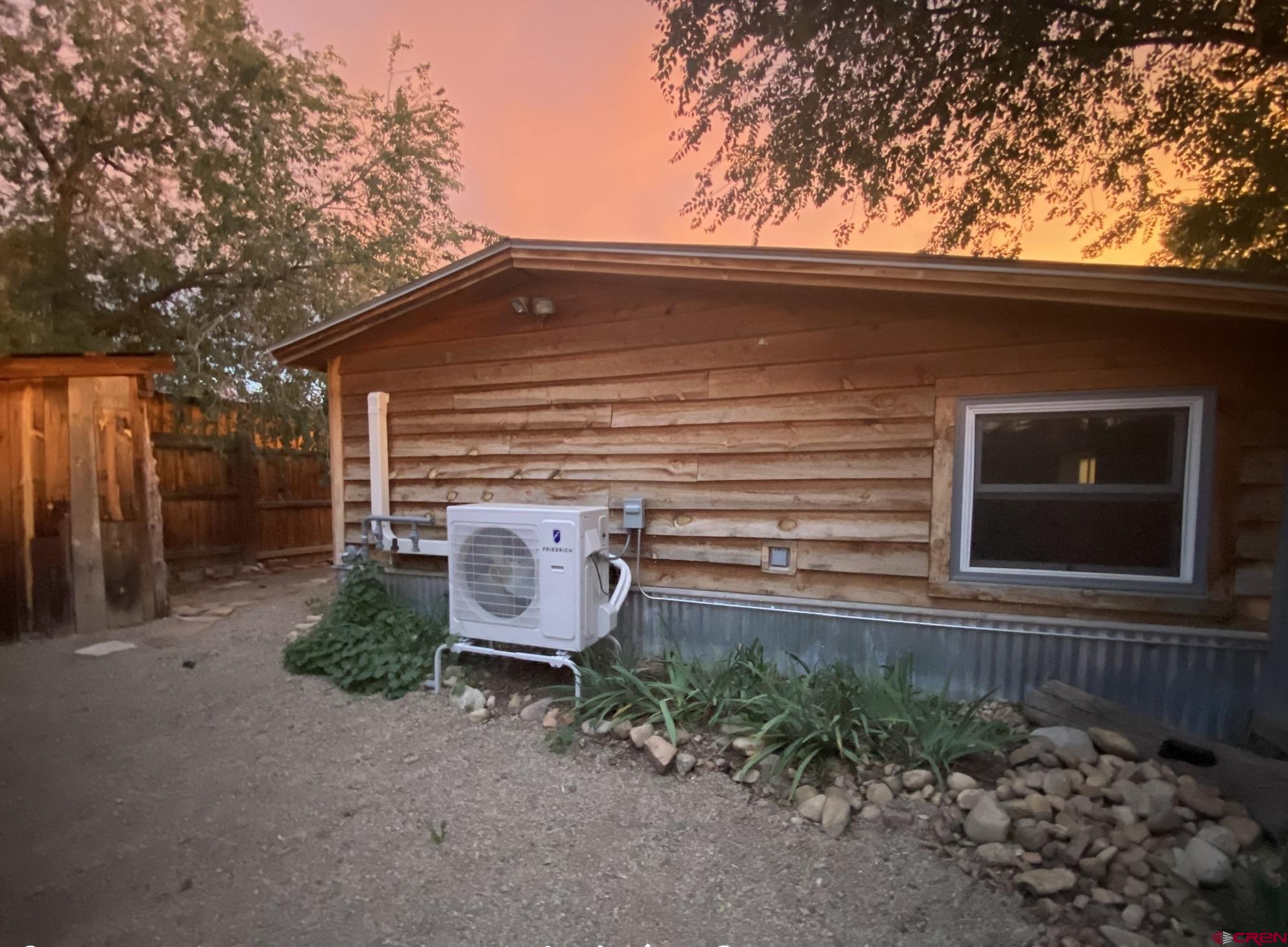 646 Riverside Avenue Mancos, CO 81328 - Photo 21 of 36 a view of a backyard with plants and large tree