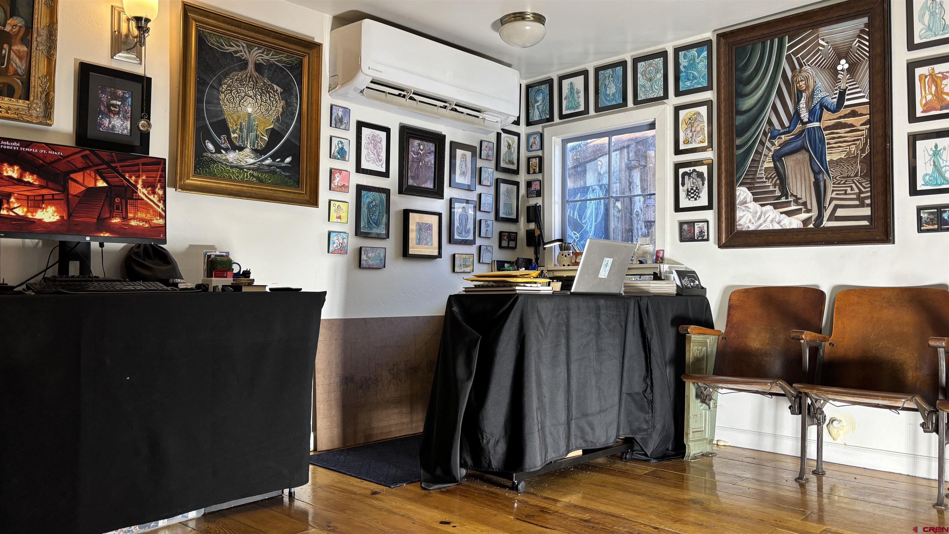 646 Riverside Avenue Mancos, CO 81328 - Photo 28 of 36 a living room with furniture and wooden floor