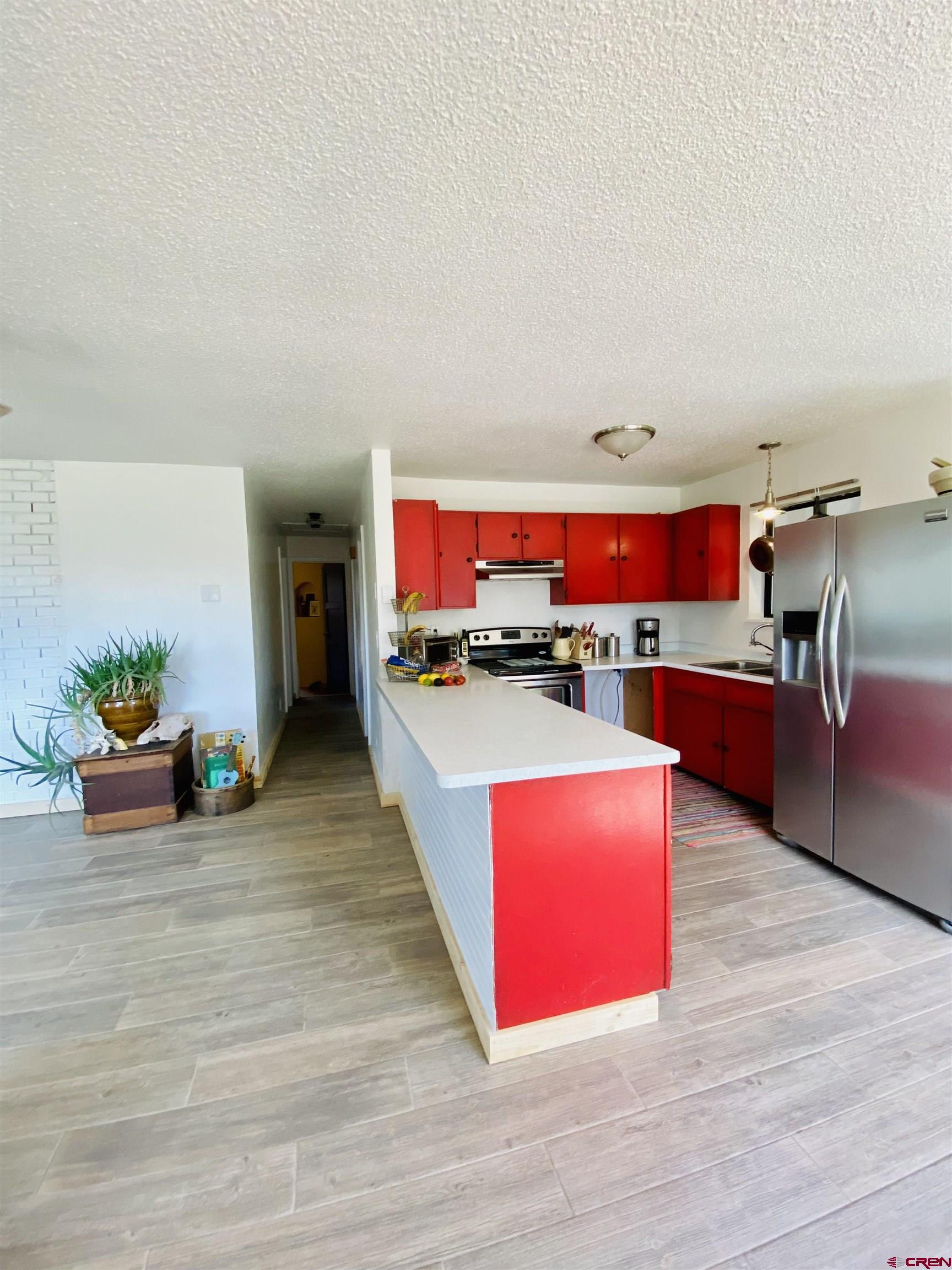 646 Riverside Avenue Mancos, CO 81328 - Photo 3 of 36 a room with furniture and view kitchen