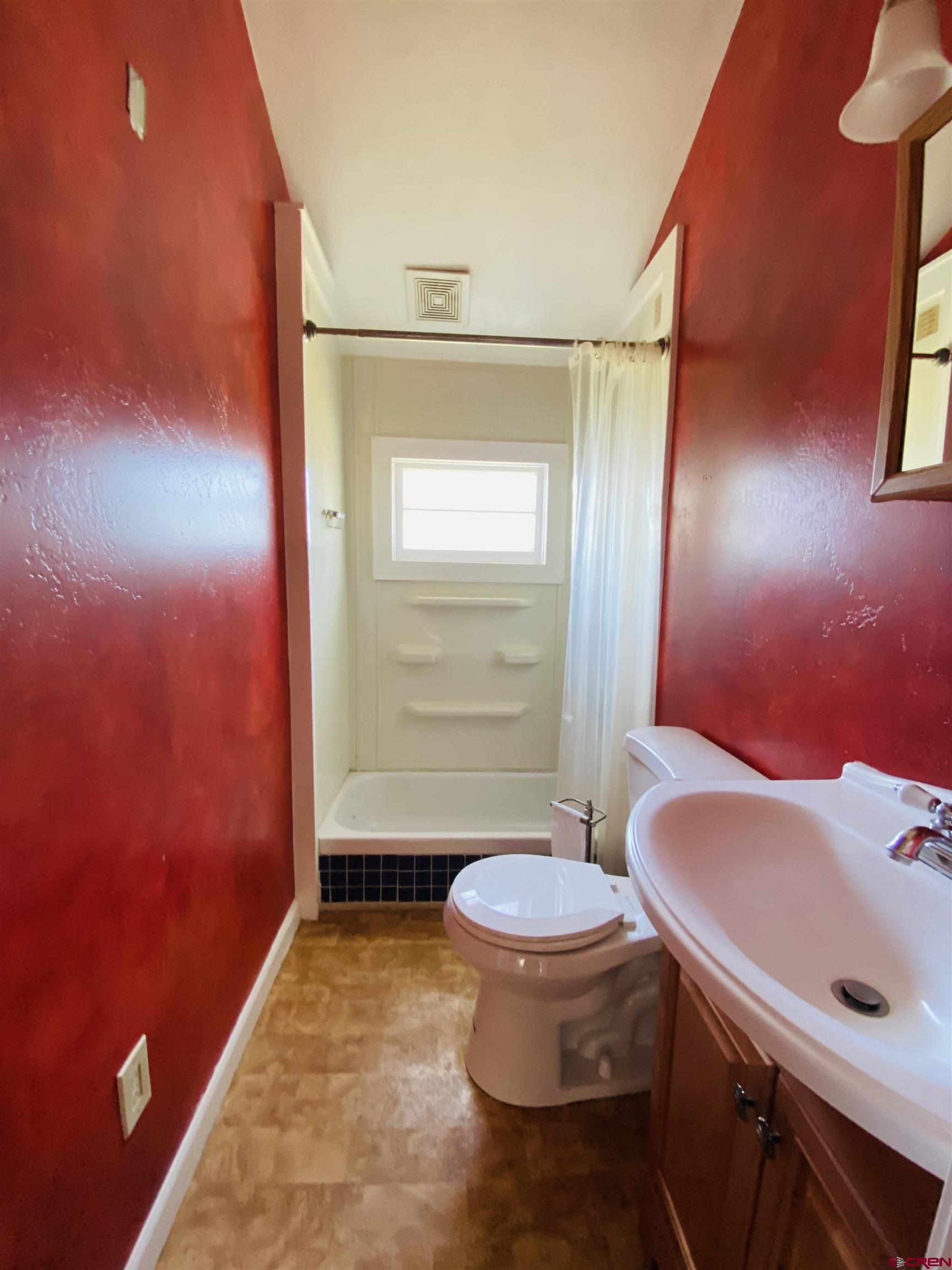 646 Riverside Avenue Mancos, CO 81328 - Photo 31 of 36 a bathroom with a sink and a mirror