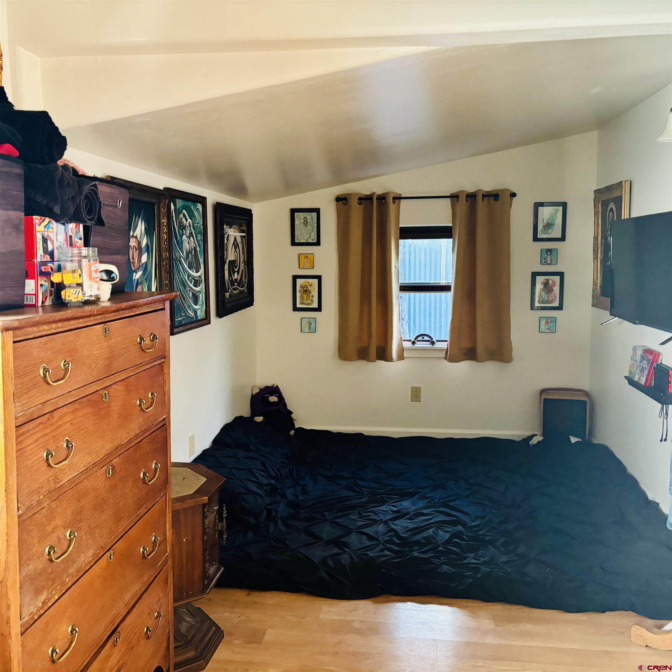 646 Riverside Avenue Mancos, CO 81328 - Photo 32 of 36 a living room with furniture and flat screen tv