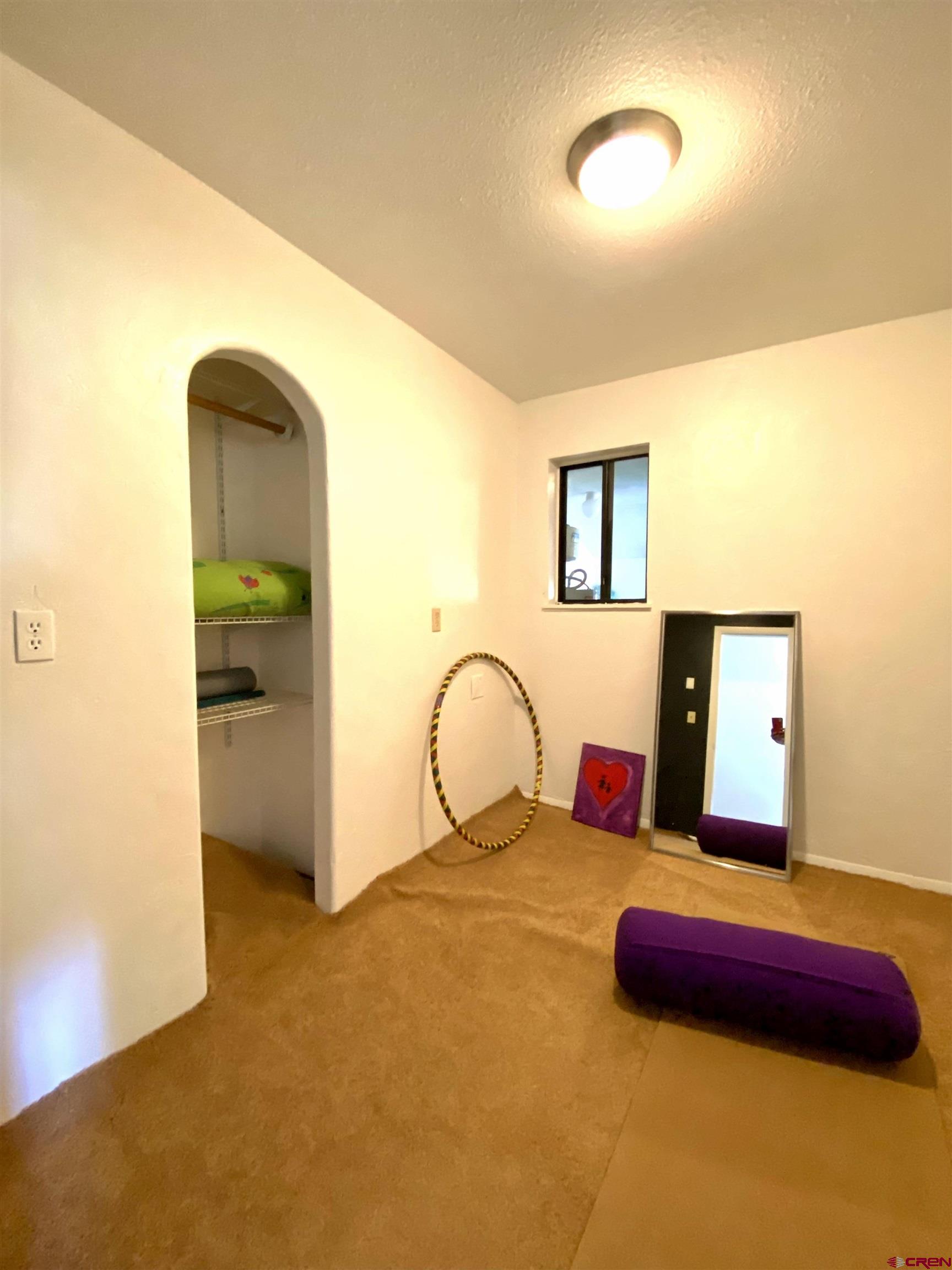 646 Riverside Avenue Mancos, CO 81328 - Photo 8 of 36 a bedroom with a bed and dresser