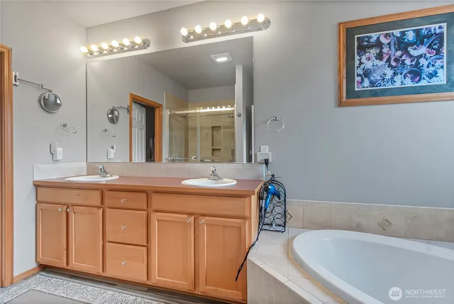 a bath room with a sink and a mirror