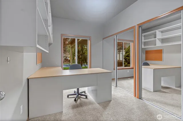 hallway with a table and chairs